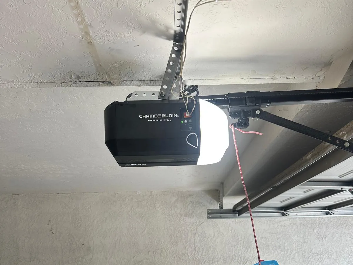 Chamberlain opener with its red emergency release cord hanging down