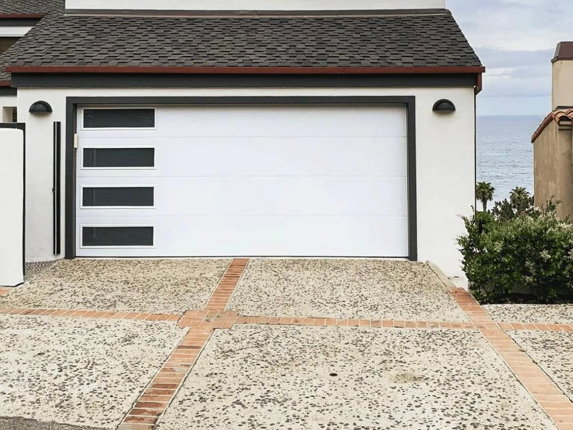 White modern garage door with a column of dark glass panels
